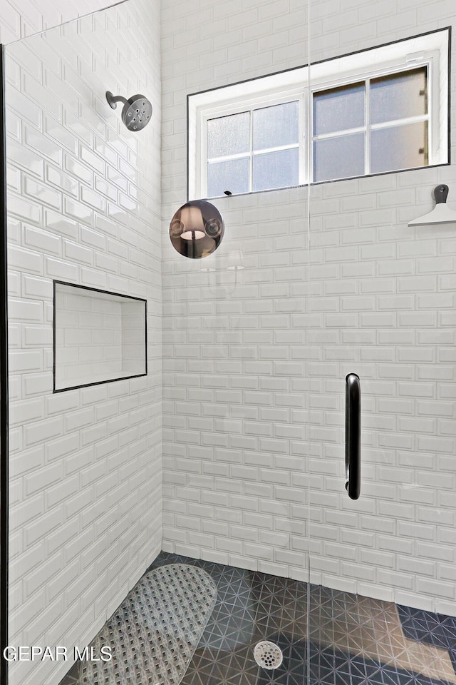 full bathroom featuring a shower stall