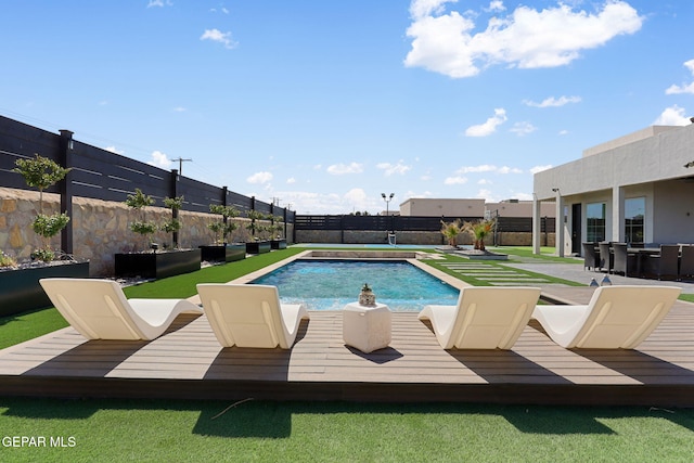 view of pool featuring a patio, a fenced backyard, and a fenced in pool