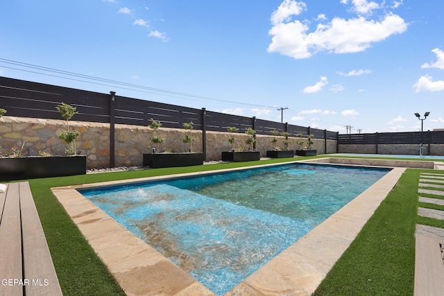 view of swimming pool with a fenced backyard and a fenced in pool