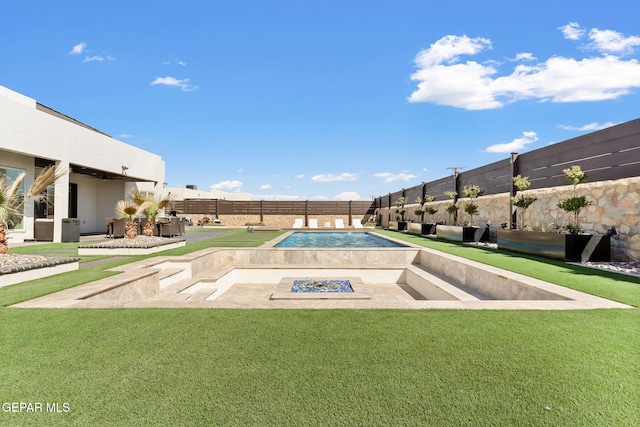 view of swimming pool with a fenced backyard, a fenced in pool, and a yard