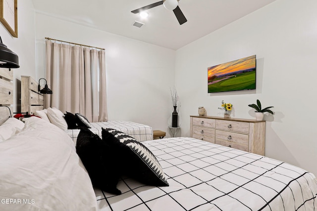 bedroom with visible vents and a ceiling fan