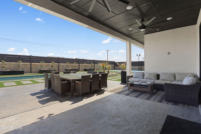 view of patio featuring an outdoor living space, outdoor dining area, a fenced backyard, and ceiling fan