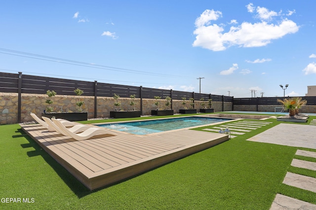 view of pool with a fenced in pool and fence