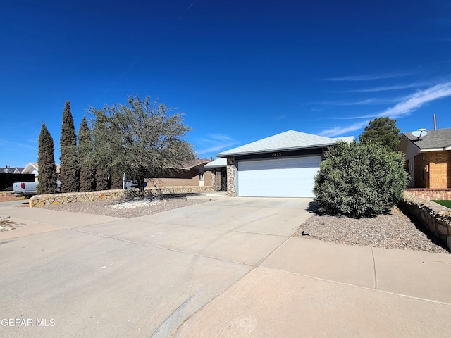 view of home's exterior with an attached garage and concrete driveway