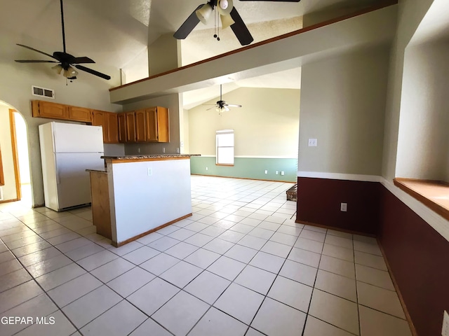 kitchen featuring visible vents, light tile patterned flooring, freestanding refrigerator, ceiling fan, and open floor plan