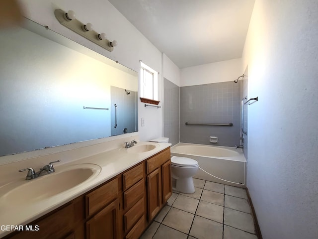 bathroom featuring tile patterned floors, double vanity, toilet, and a sink