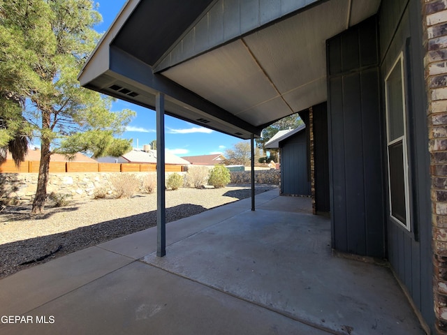 view of patio / terrace featuring fence