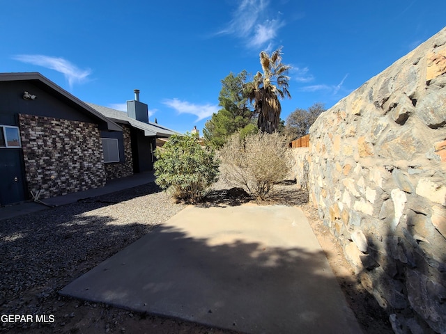 view of yard featuring a patio and fence