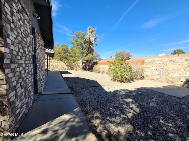 view of yard featuring a patio and a fenced backyard