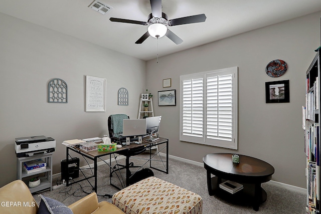 office area with a ceiling fan, visible vents, carpet floors, and baseboards