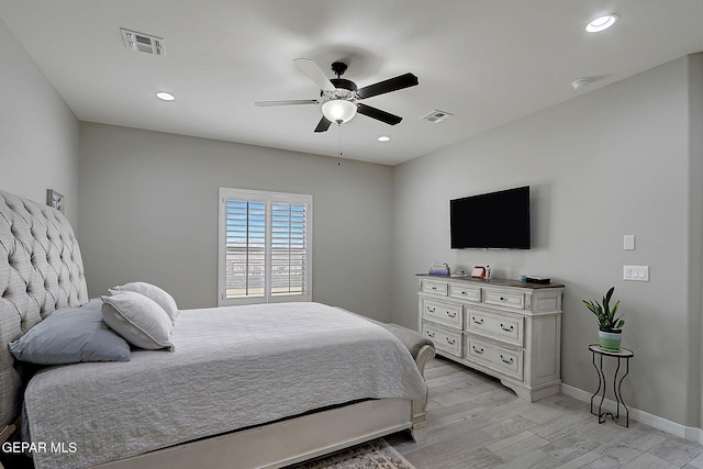 bedroom featuring light wood-type flooring, visible vents, and recessed lighting