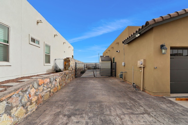 view of property exterior featuring stucco siding and a tiled roof