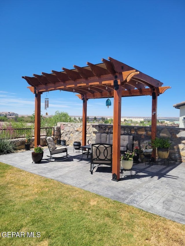 exterior space with a lawn, a pergola, a patio, and fence