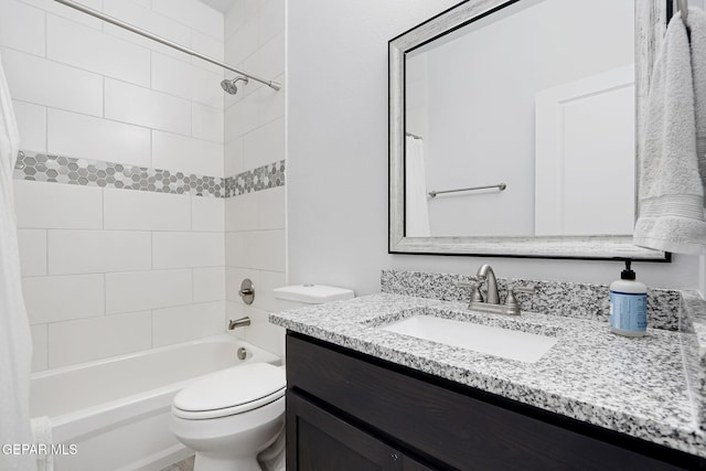 bathroom with vanity, shower / tub combo, and toilet