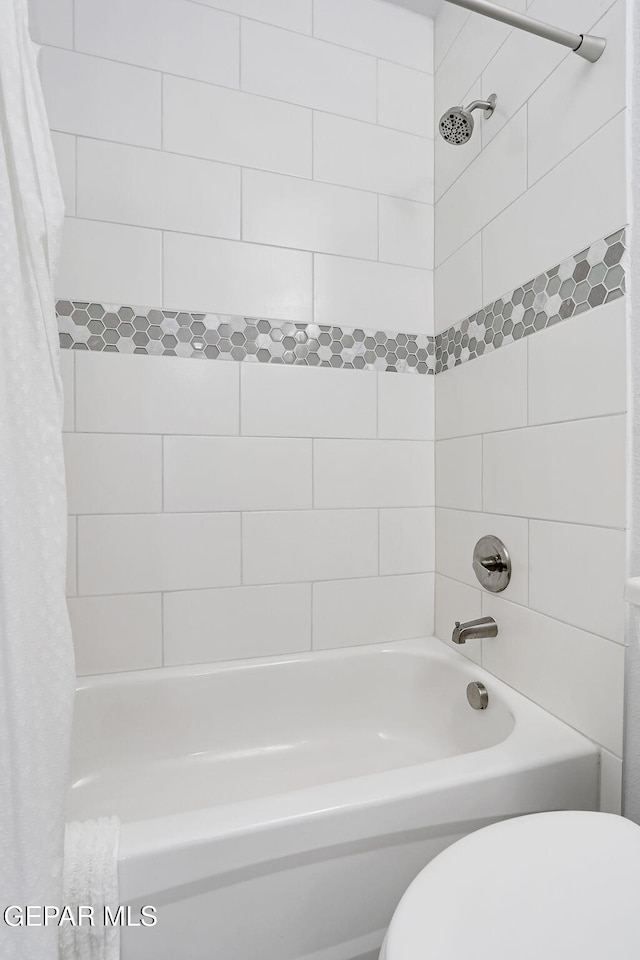 full bathroom with toilet and shower / bath combination with curtain