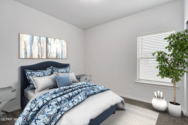 bedroom with baseboards and carpet floors