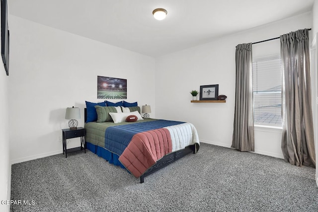 bedroom with carpet flooring and baseboards