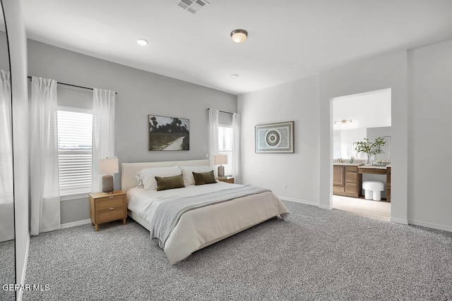 bedroom with carpet flooring, baseboards, connected bathroom, and recessed lighting