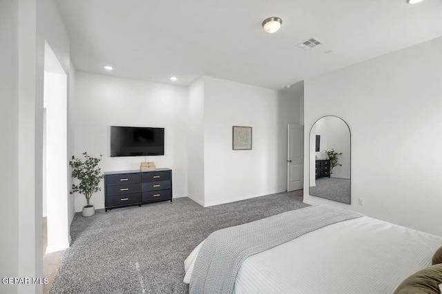 bedroom with light colored carpet, recessed lighting, and baseboards