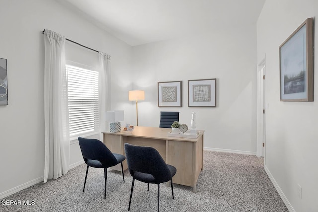office space featuring light colored carpet and baseboards