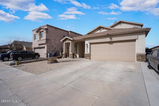 view of front of property with stucco siding, stone siding, and concrete driveway