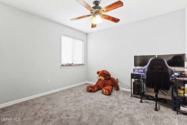 home office featuring baseboards, carpet, and a ceiling fan