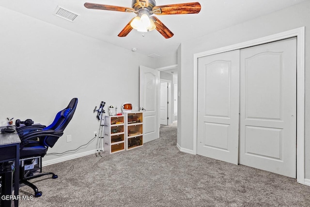 office with visible vents, baseboards, carpet, and a ceiling fan