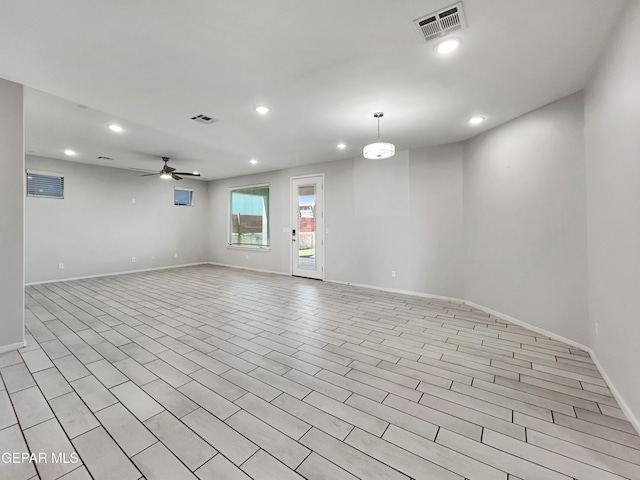 spare room with recessed lighting, visible vents, and a ceiling fan