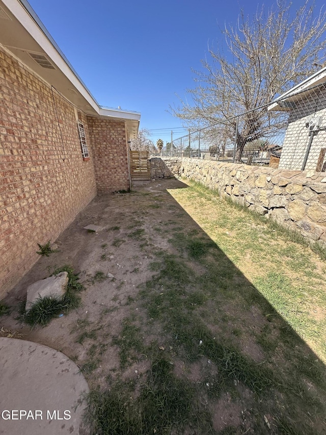 view of yard with fence