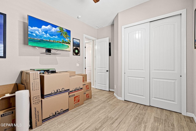 interior space with light wood-type flooring and baseboards