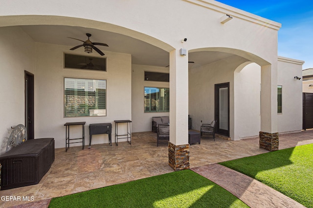 view of patio / terrace with ceiling fan and an outdoor hangout area