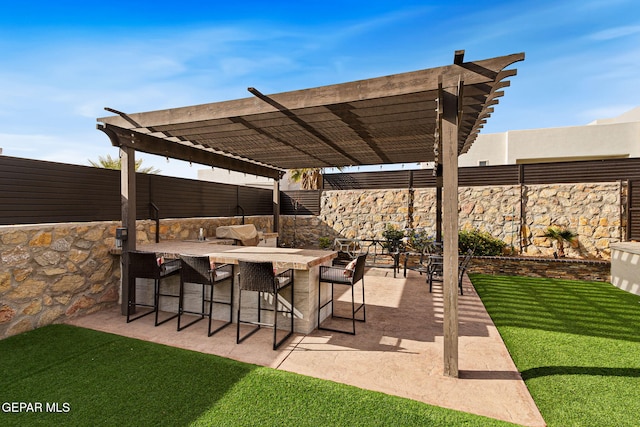 view of patio / terrace featuring fence, outdoor dry bar, and a pergola