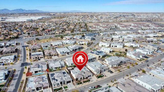 drone / aerial view with a residential view and a mountain view