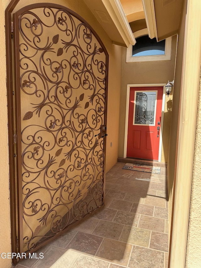 doorway to property featuring a gate