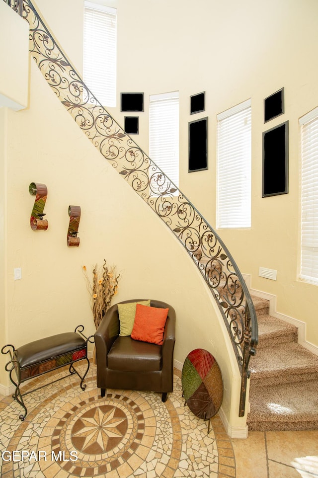 staircase featuring baseboards