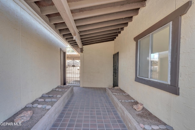 view of patio featuring a gate