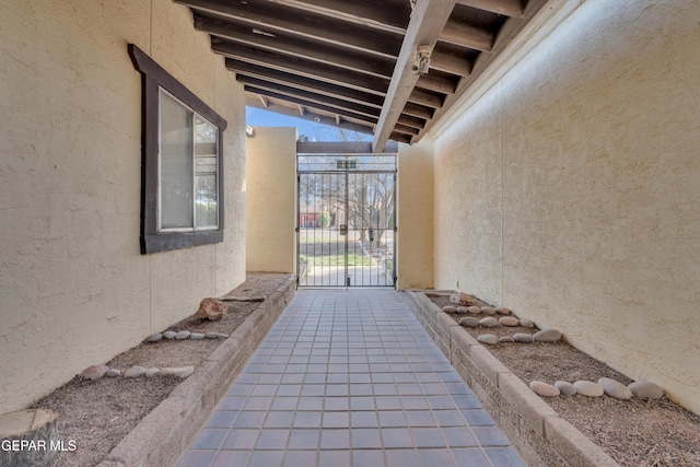 view of patio with a gate