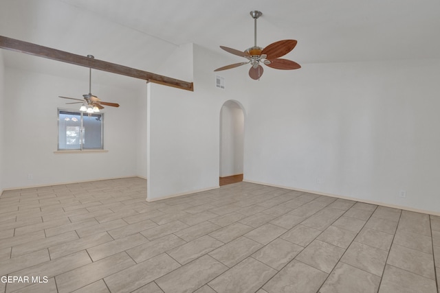 spare room with beam ceiling, a ceiling fan, arched walkways, and visible vents