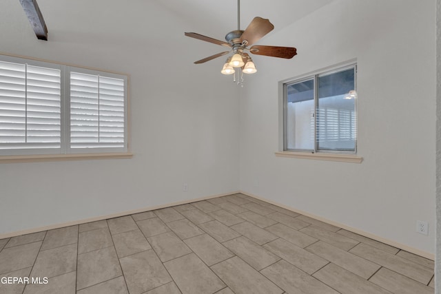 unfurnished room with a wealth of natural light and a ceiling fan