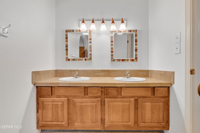 bathroom with double vanity and a sink