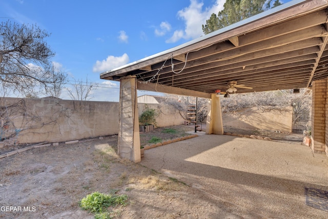 view of patio featuring fence