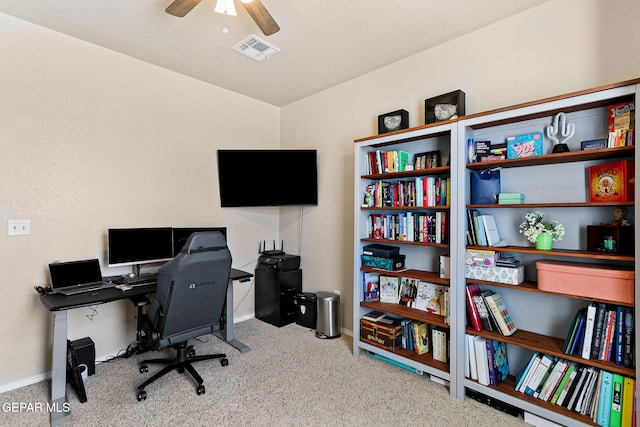 office space featuring visible vents, ceiling fan, and baseboards