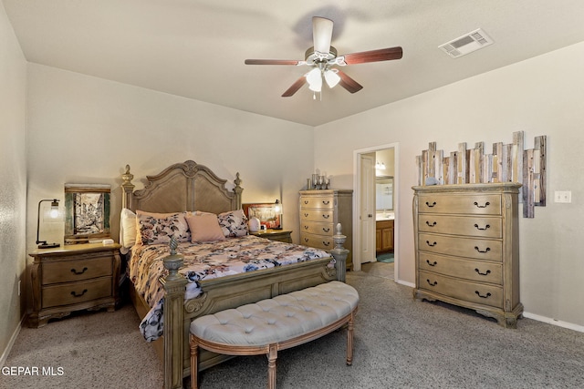 carpeted bedroom with ceiling fan, visible vents, baseboards, and connected bathroom