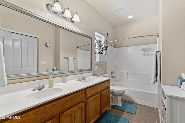 bathroom with tile patterned floors, visible vents, double vanity, and a sink