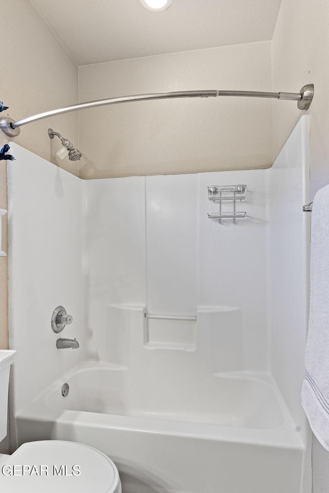 full bath featuring shower / bathing tub combination and toilet