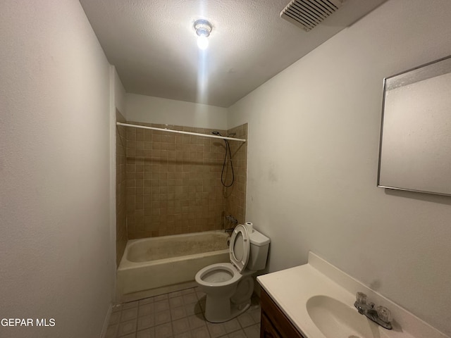 bathroom featuring visible vents, toilet, a textured ceiling, washtub / shower combination, and vanity