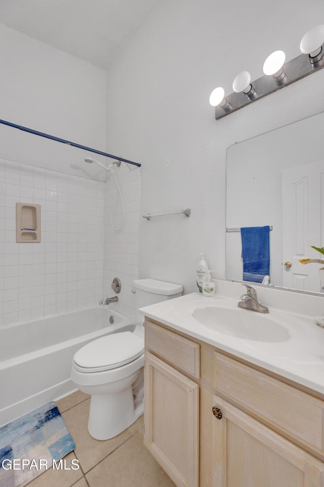 bathroom featuring vanity, tile patterned floors, toilet, and shower / bathtub combination