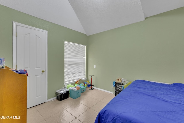 tiled bedroom featuring baseboards and vaulted ceiling