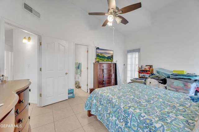 bedroom with high vaulted ceiling, light tile patterned floors, visible vents, and ceiling fan