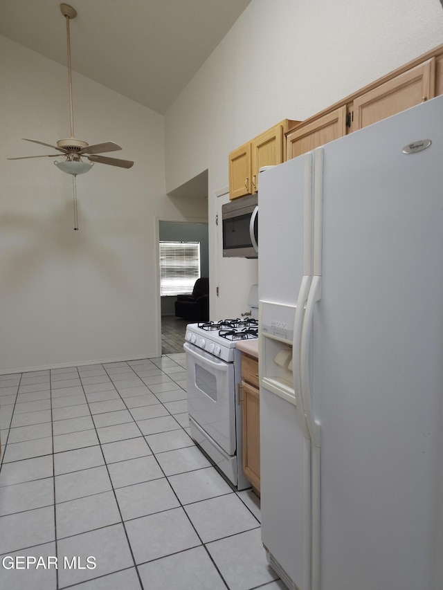 kitchen with white appliances, light tile patterned floors, high vaulted ceiling, light brown cabinetry, and ceiling fan